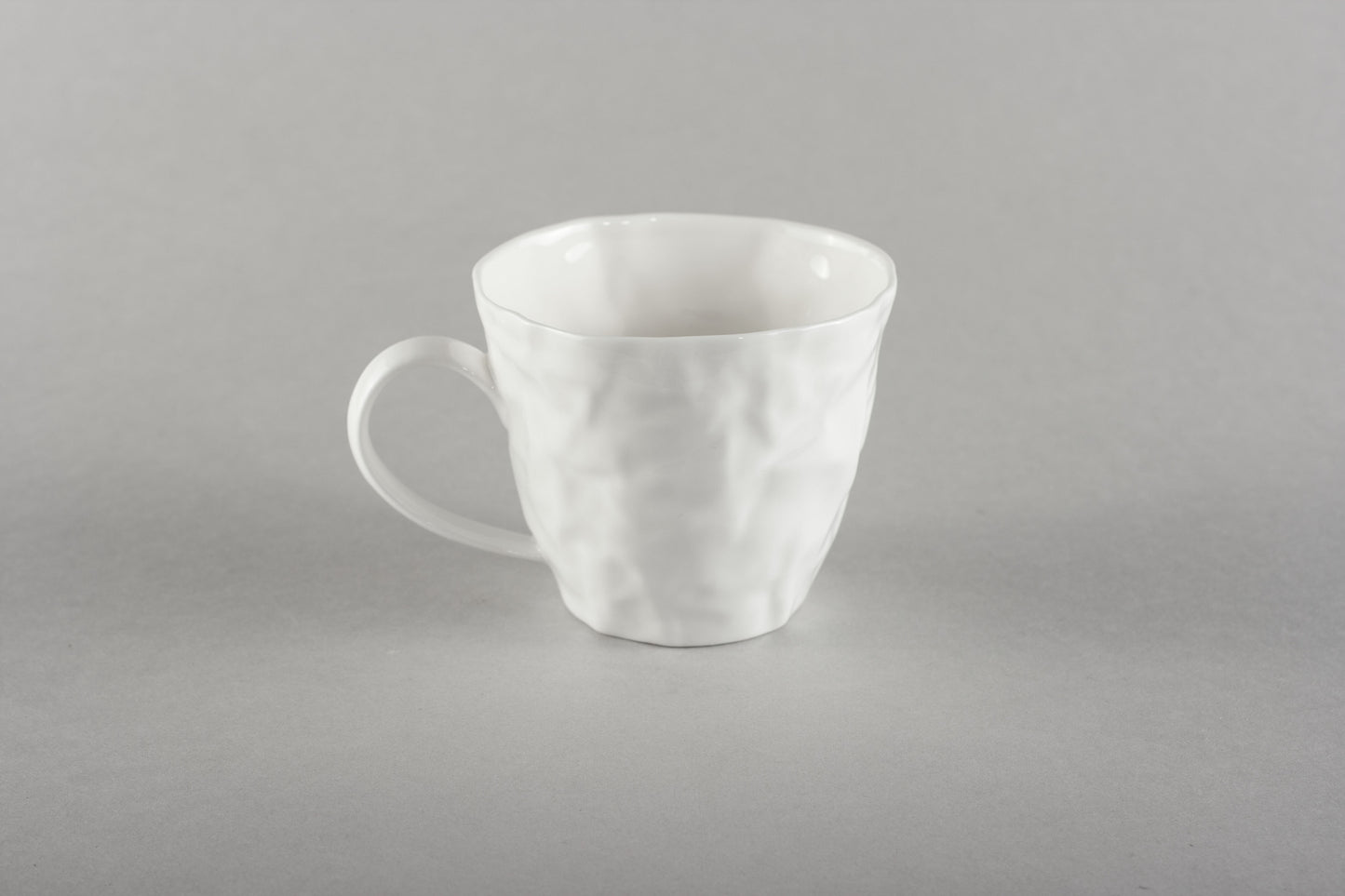 Porcelāna burzīta kafijas krūze Co